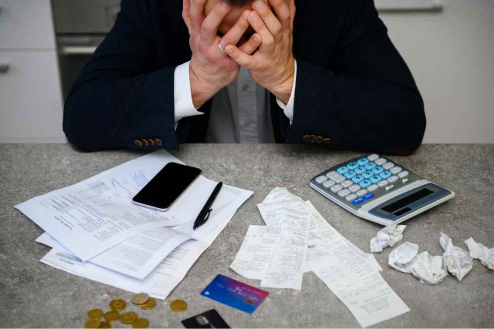worried-man-calculating-budget-finances worried-man-calculating-budget-finances